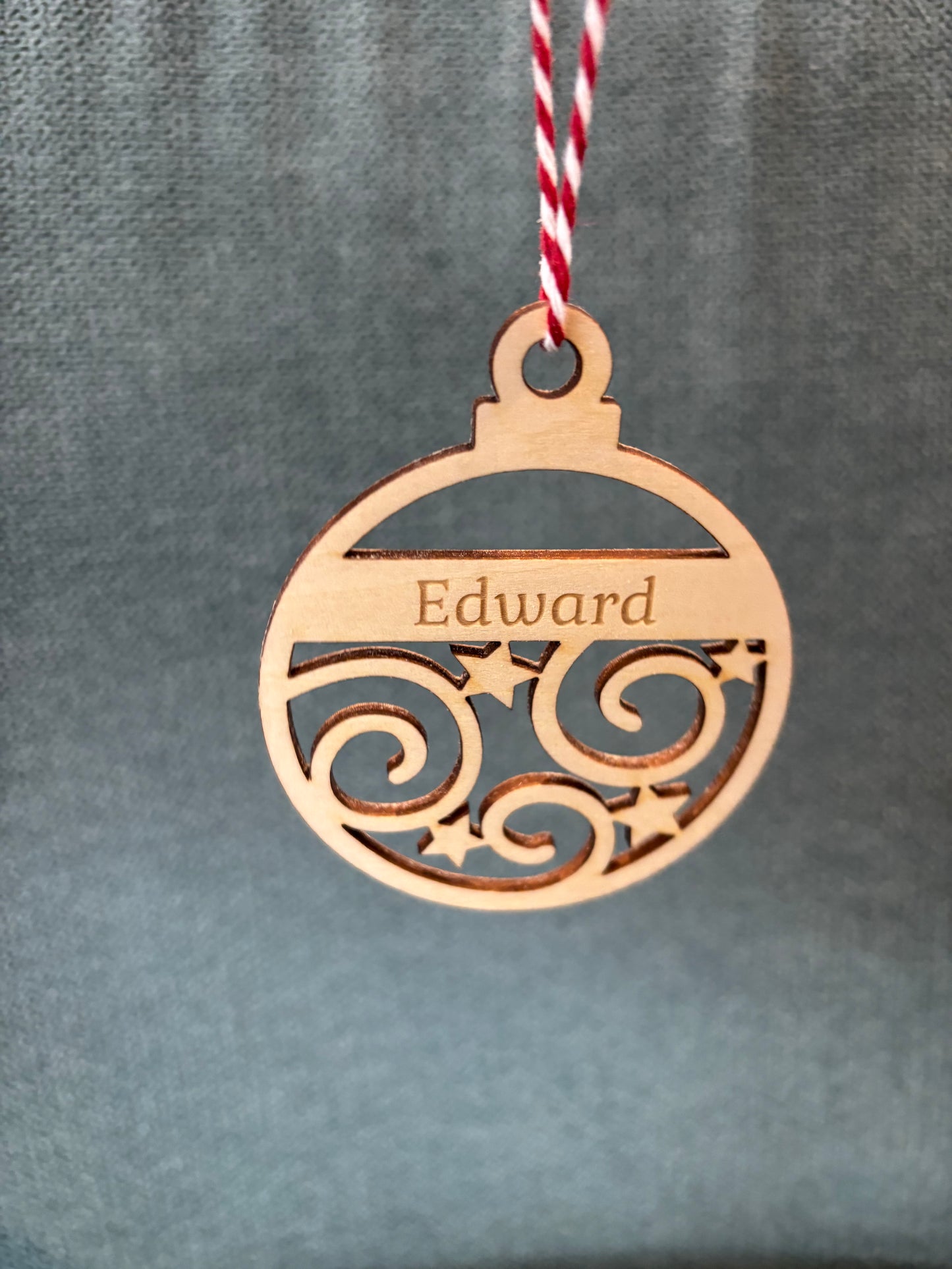 Personalised wooden swirl and stars bauble